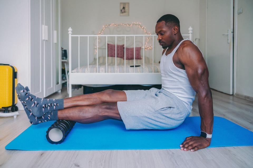 Foam rolling is a self-directed way to massage out the knots. <a href="https://www.gettyimages.com/detail/photo/home-workout-with-foam-roller-royalty-free-image/1367817911" rel="nofollow noopener" target="_blank" data-ylk="slk:martin-dm/E+ via Getty Images;elm:context_link;itc:0;sec:content-canvas" class="link ">martin-dm/E+ via Getty Images</a>