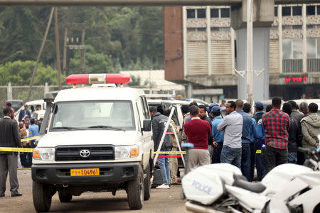 Investigators inspect the scene, where Ethiopia's Grand Renaissance Dam Project Manager Simegnew Bekele was found dead in his car in Addis Ababa, Ethiopia July, 26, 2018 REUTERS/Tiksa Negeri