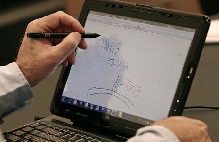 File photo of Amihai Ben-David, former chief executive of N-trig, demonstrating a pen and touch device at his office in Kfar Saba, near Tel Aviv on April 6, 2009. REUTERS/Gil Cohen Magen