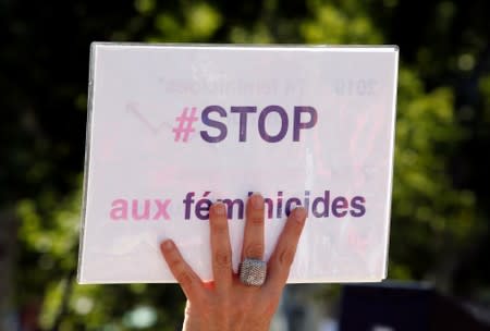Families of victims and activists attend a rally against "femicide", gender-based violence targeted at women, in Paris
