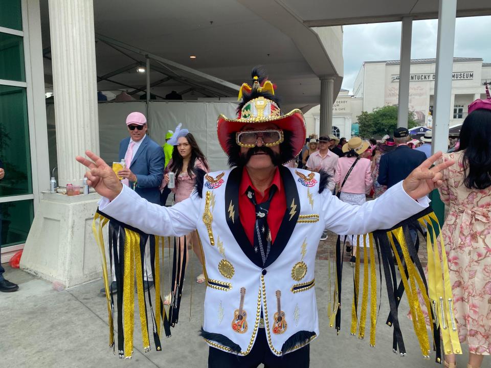Gregorio Banuelos, 64, sports a flashy white suit jacket with the words “Mexican Elvis” on the back for Kentucky Oaks Day.