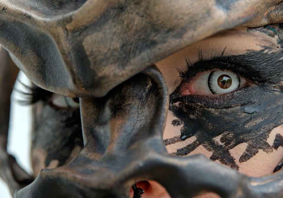 <p>A participant in a fancy costume attends the Wave Gothic Festival (WGT) in Leipzig, Germany, Saturday, June 3, 2017. (AP Photo/Jens Meyer) </p>