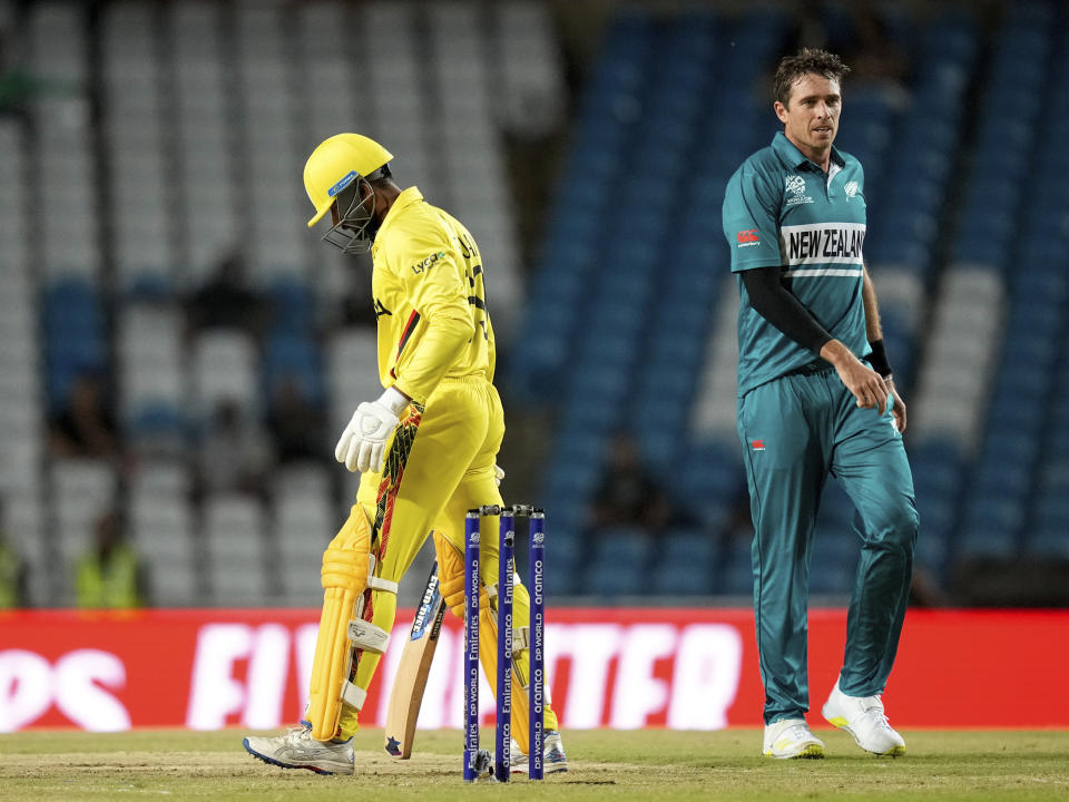 Uganda's Alpesh Ramjani reacts after being trapped LBW for a duck by New Zealand's Tim Southee, right, during an ICC Men's T20 World Cup cricket match at the Brian Lara Cricket Academy in Tarouba, Trinidad and Tobago, Friday, June 14, 2024. (AP Photo/Ramon Espinosa)