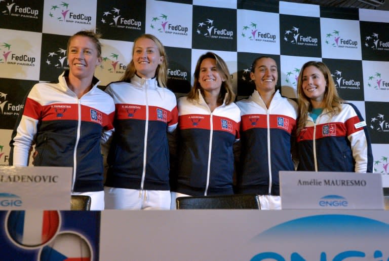 French Fed Cup coach Amelie Mauresmo (C) poses with players (from L), Pauline Parmentier, Kristina Mladenovic, Caroline Garcia and Alize Cornet during a press conference in Strasbourg, on November 8, 2016