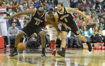 WASHINGTON, DC February 8 : Washington Wizards point guard John Wall (2) gets sandwiched by Brooklyn Nets power forward Reggie Evans (30) and guard Deron Williams (8) going after a loose ball in the 4th quarter on February 8, 2013 in Washington, DC (Photo by Jonathan Newton / The Washington Post via Getty Images)