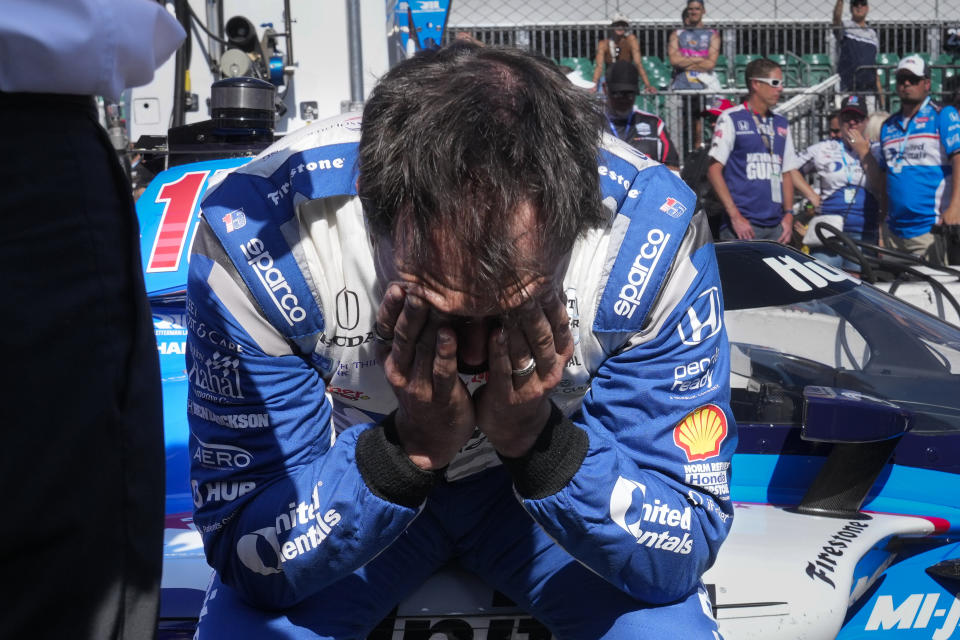 Graham Rahal sits on the side of his car after failing to make the field during qualifications for the Indy 500 auto race at Indianapolis Motor Speedway in Indianapolis, Sunday, May 21, 2023. (AP Photo/Michael Conroy)