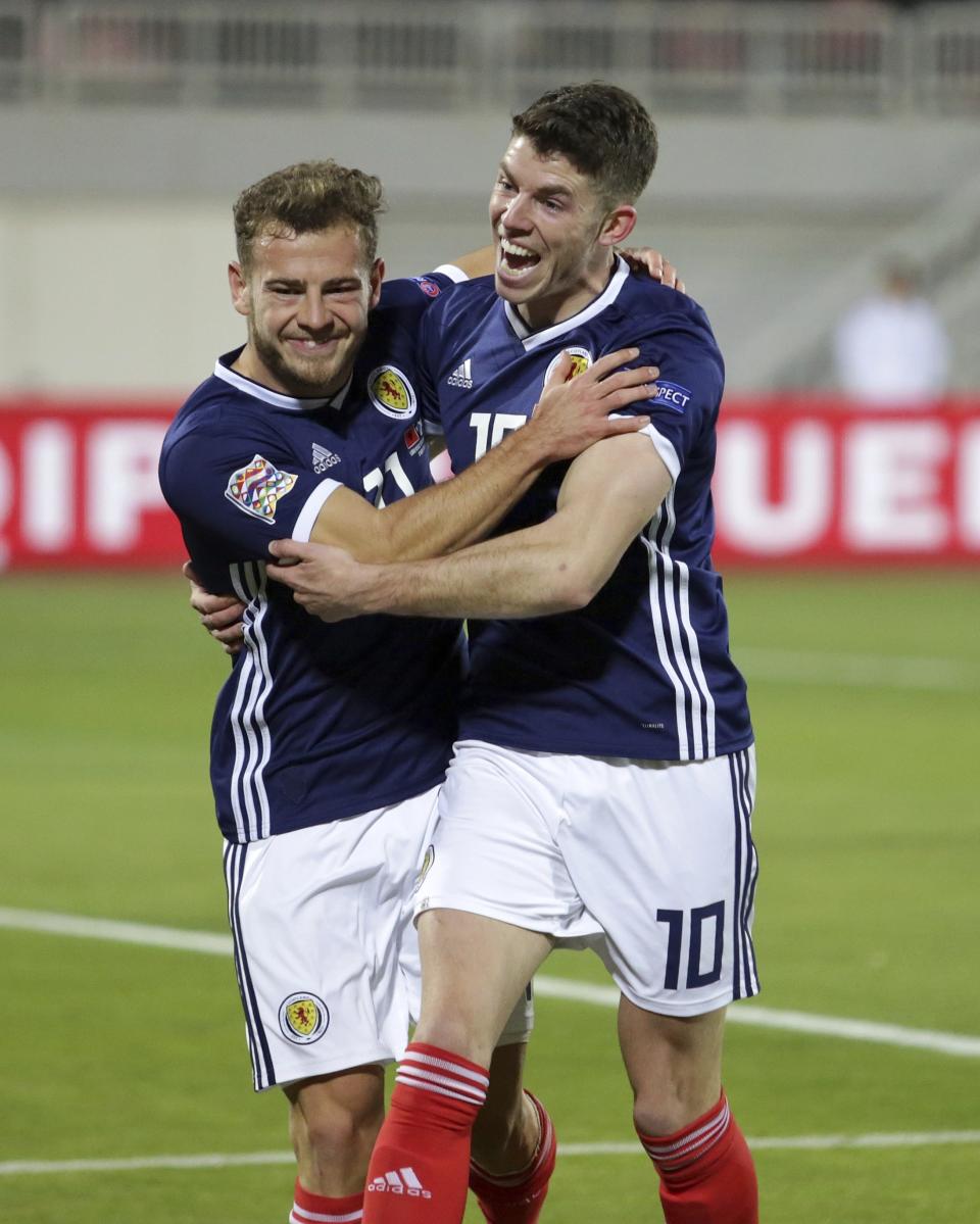 Scotland's Ryan Fraser, left, celebrates after scoring the opening goal of his team with his teammate Ryan Christie during the UEFA Nations League soccer match between Albania and Scotland at Loro Borici stadium, in Shkoder, northern Albania, Saturday, Nov. 17, 2018. (AP Photo/Hektor Pustina)