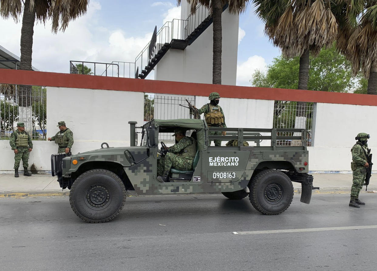 Mexican army soldiers prepare a search mission for four U.S. citizens kidnapped by gunmen at Matamoros, Mexico.