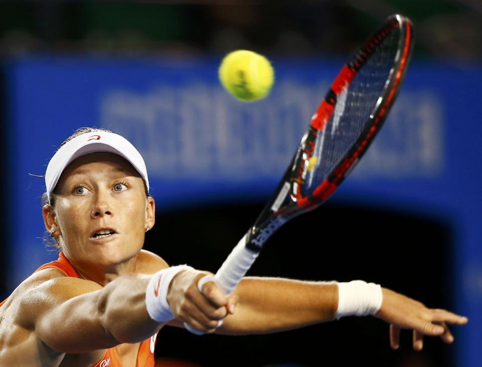 Samantha Stosur of Australia hits a return against Coco Vandeweghe of the U.S. during their women's singles second round match at the Australian Open 2015 tennis tournament in Melbourne