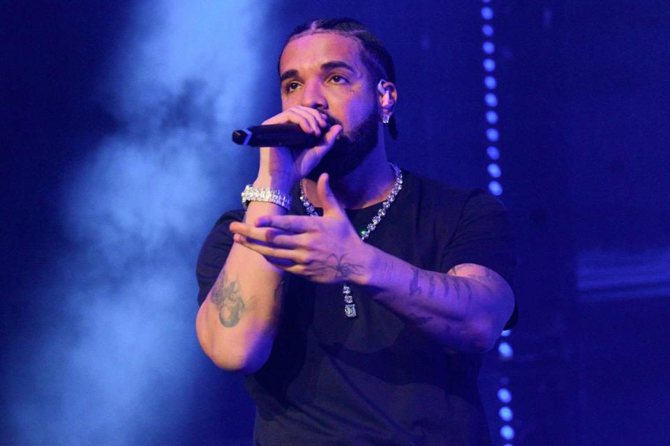<p>Prince Williams/Wireimage</p> Rapper Drake performs onstage during "Lil Baby & Friends Birthday Celebration Concert" at State Farm Arena on December 9, 202