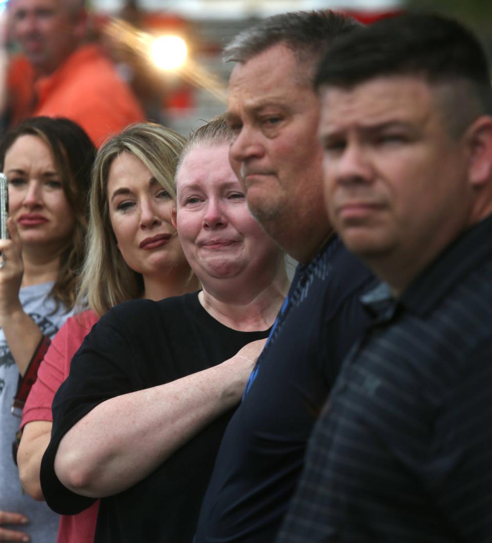 The crowd watched Sheriff’s Deputy William Petry and Prestonsburg Police Capt. Ralph Frasure, who were killed trying to serve a warrant yesterday, as they were brought back from the Frankfort today.July 1, 2022