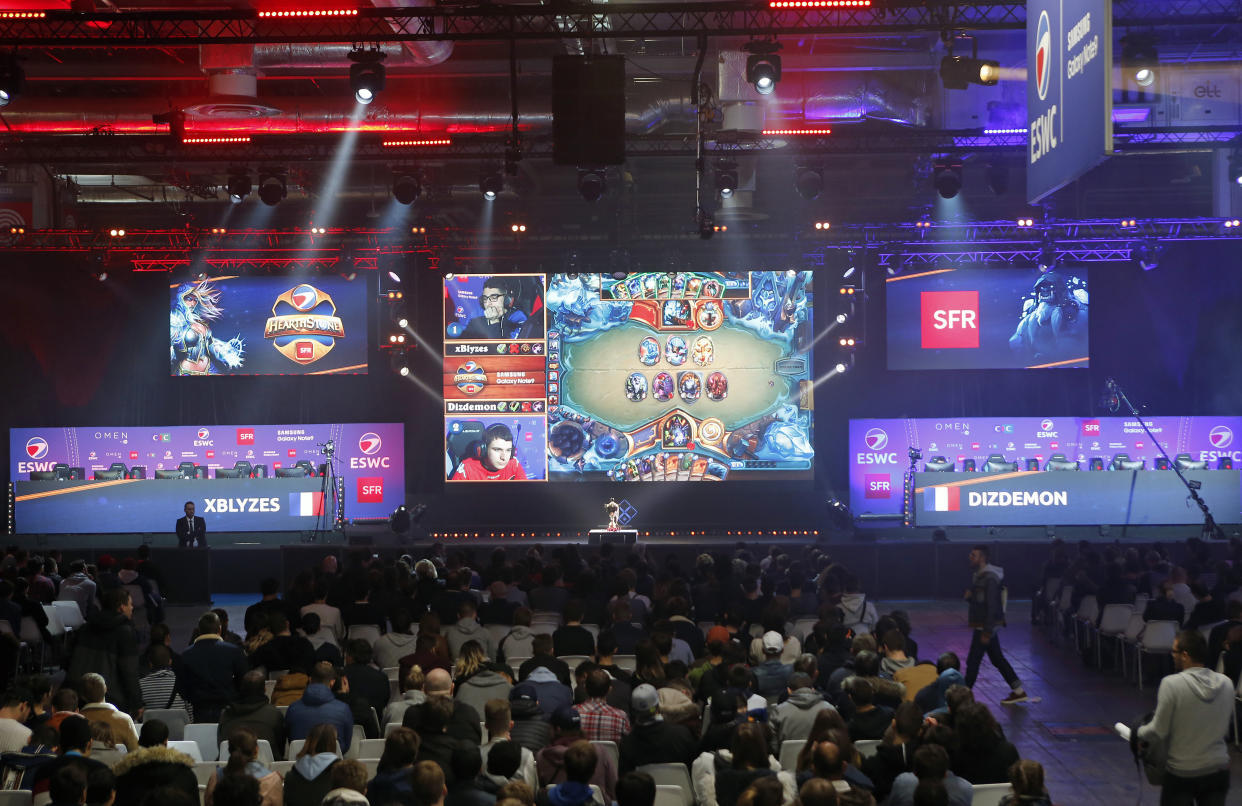 Fans watch a&nbsp;Hearthstone video game tournament during Paris Games Week last October in France. (Photo: Chesnot via Getty Images)