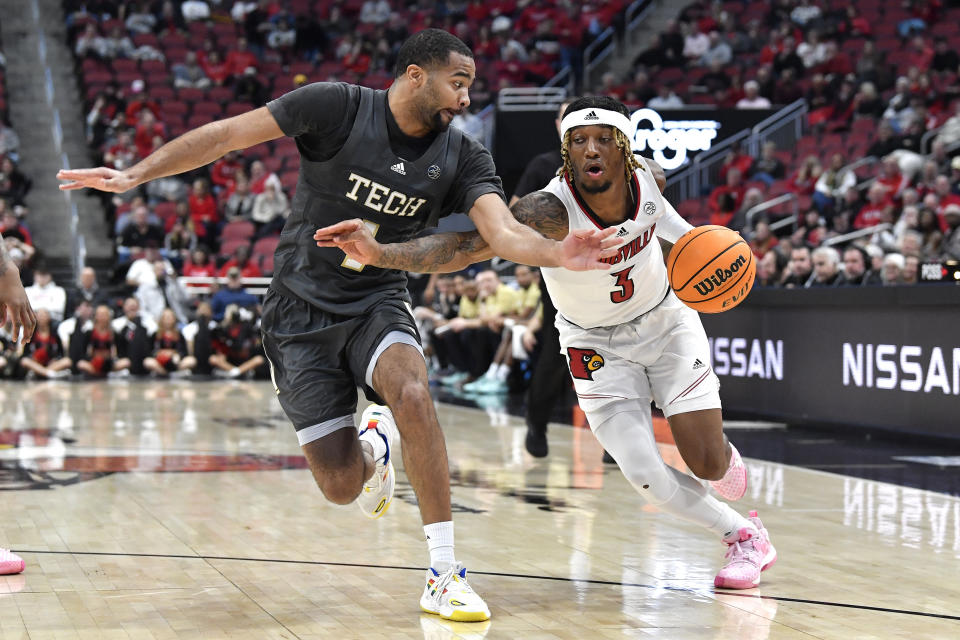 Louisville guard El Ellis (3) drives past Georgia Tech guard Kyle Sturdivant (1) during the second half of an NCAA college basketball game in Louisville, Ky., Wednesday, Feb. 1, 2023. Louisvile won 68-58. (AP Photo/Timothy D. Easley)