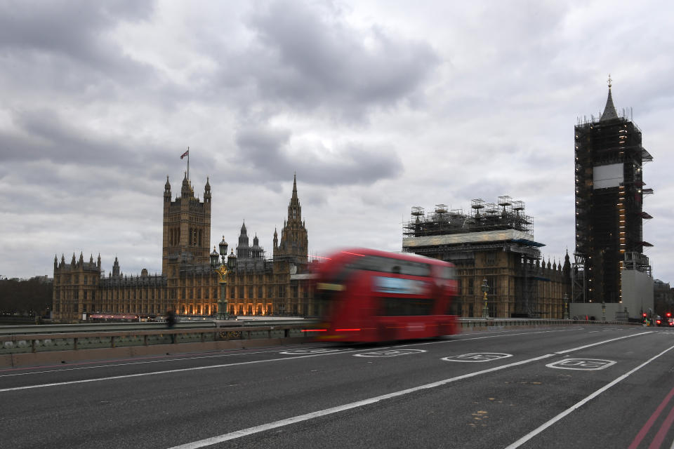 FILE - In this Wednesday, April 1, 2020 file photo, a double decker bus drives along an empty Westminster Bridge in London. The European Union on Tuesday, April 21, 2020 says its vaunted tourism industry is facing decline due to the coronavirus crisis while Internal market Commissioner Thierry Breton says it should be the prime sector to receive over a fifth of all recovery funds. (AP Photo/Alberto Pezzali, File)