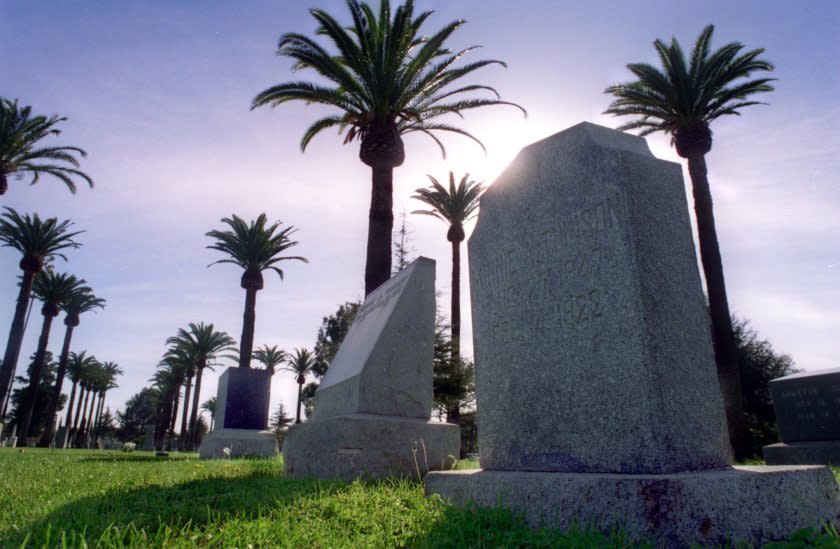 LS.Cemeteries–1 /18/96–Palm trees surround the graves and headstones in Santa Ana Cemetary which is located on Santa Clara Ave. in Santa Ana. KODAK A