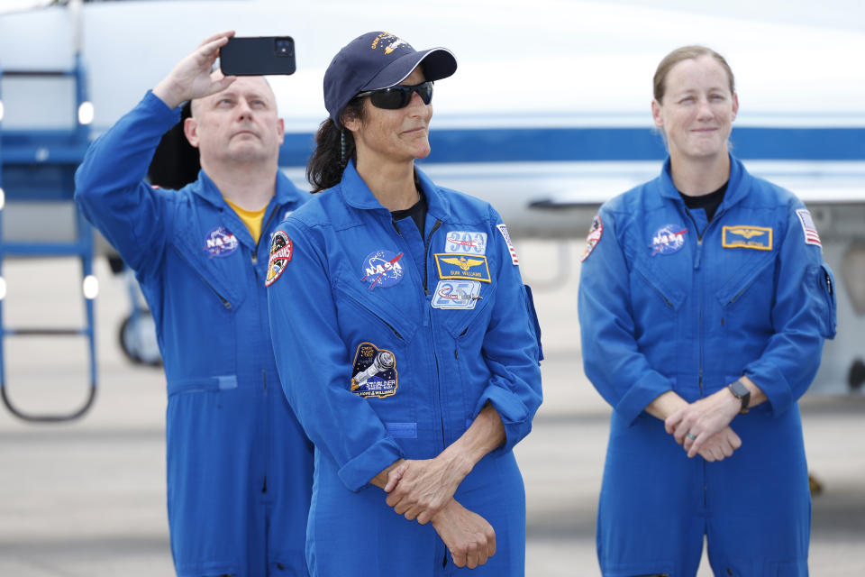 NASA astronaut Suni Williams with support crew in the background speaks to the media after arriving at the Kennedy Space Center, Thursday, April 25, 2024, in Cape Canaveral, Fla. The two test pilot crew will launch aboard Boeing's Starliner capsule atop an Atlas rocket to the International Space Station, scheduled for liftoff on May 6, 2024. (AP Photo/Terry Renna)