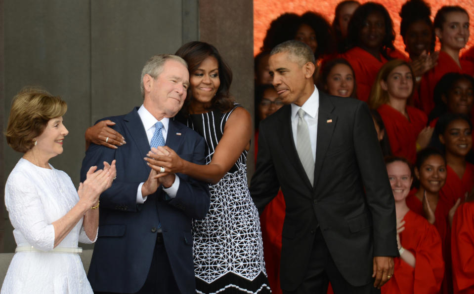 Michelle Obama has called George W. Bush (pictured with her and their respective spouses, Laura Bush and Barack Obama) her “partner in crime.” (Photo: Astrid Riecken/Getty Images)