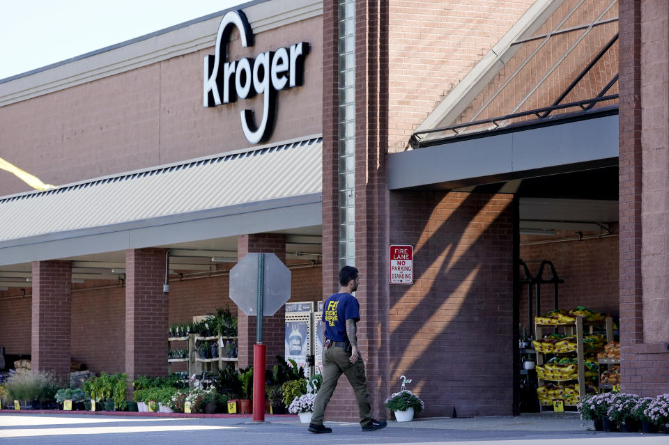 An FBI agent enters a Kroger grocery store Friday, Sept. 24, 2021, in Collierville, Tenn. Police say a gunman, who has been identified as a third-party vendor to the store, attacked people Thursday and killed at least one person and wounded others before being found dead of an apparent self-inflicted gunshot wound. (AP Photo/Mark Humphrey)