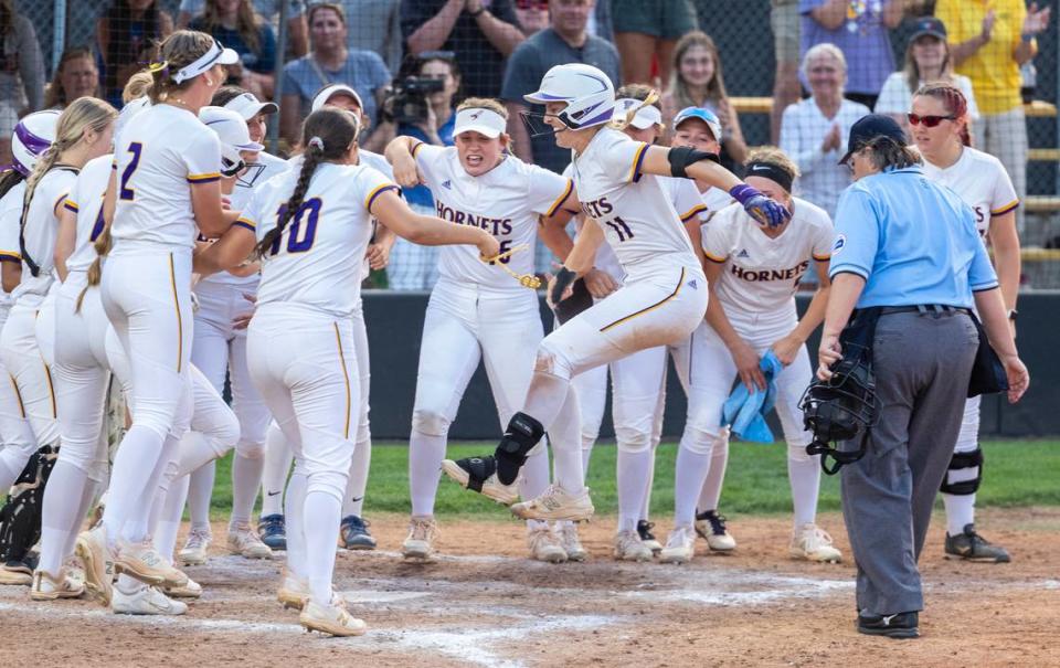 Valley Center players celebrate a grand slam by Sykora Smith in the sixth inning of the 5A championship game against Goddard Eisenhower on Friday night.