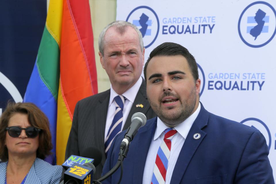 Christian Fuscarino, right, executive director of Garden State Equality, speaks during a press conference to announce then-candidate Phil Murphy receive the Garden State Equality endorsement for governor on the Asbury Park Boardwalk, July 5, 2017.