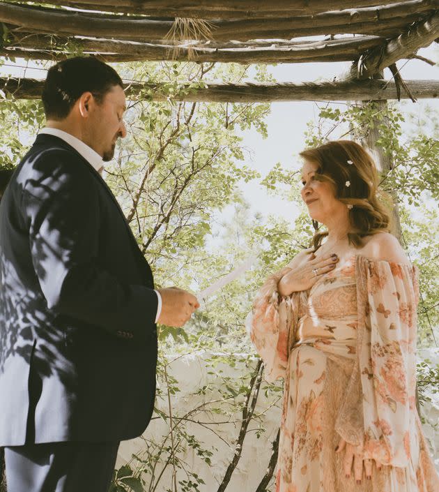 The author and her husband, Brian, exchanging their vows. (Photo: Courtesy of Marisa Youngblood)