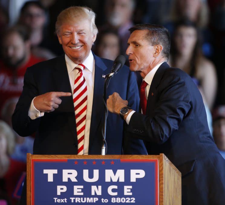 Donald Trump (L) jokes with retired Gen. Michael Flynn as they speak at a rally at Grand Junction Regional Airport on October 18, 2016 in Grand Junction Colorado. (Photo: George Frey/Getty Images)