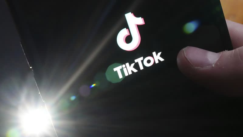 The TikTok startup page is displayed on an iPhone in Ottawa, Ontario, Feb. 27, 2023. On March 15, 2023, TikTok reported that the Biden administration has threatened to ban the app if ByteDance doesn’t sell the app.