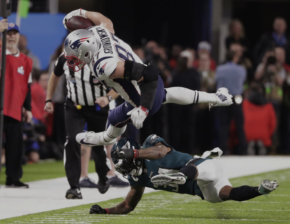 <p>Philadelphia Eagles cornerback Jalen Mills (31) tackles New England Patriots tight end Rob Gronkowski (87), during the second half of the NFL Super Bowl 52 football game Sunday, Feb. 4, 2018, in Minneapolis. (AP Photo/Tony Gutierrez) </p>