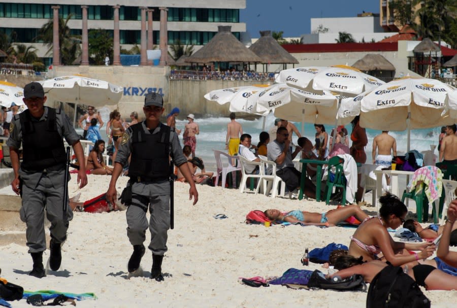 Police patrol the beaches of Cancun, Mexico, March 6, 2005 in a operation aimed at maintaining order during the year’s spring break tourist season. A surge in student interest in the Pacific resort city of Acapulco comes as Mexico’s spring-break king, the Caribbean resort of Cancun, is taking baby steps to restrict the college crowd’s increasingly reckless behavior and to tone down its nonstop party image.(AP Photo/Israel Leal)**EFE OUT**