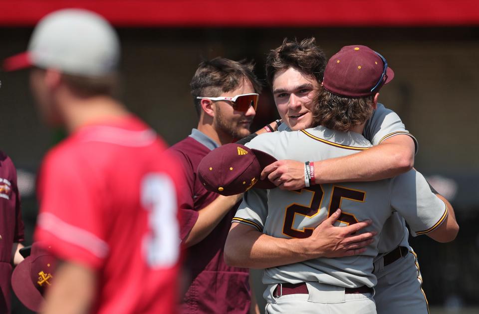 Walsh Jesuit winning pitcher Ryan Piech, facing, celebrates with shortstop Joey Canzoni after beating Wadsworth on Thursday to advance to the Division I regional final.