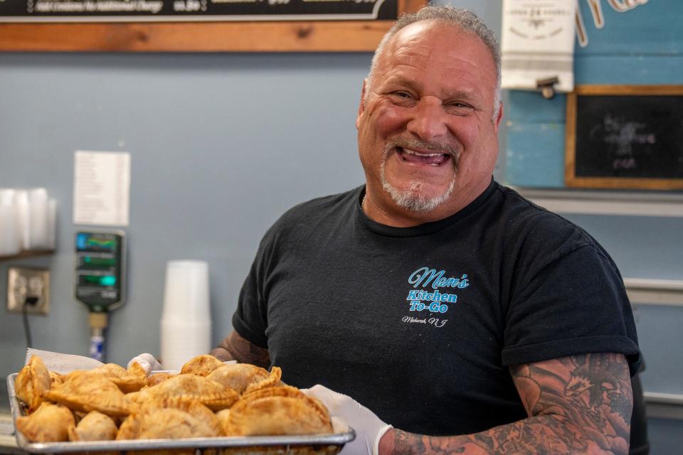 Apr 25, 2024; Mahwah, N.J., United States; Pete Vitale holds a tray of freshly made empanadas at Mom's Kitchen To-Go on Thursday afternoon. Vitale opened the restaurant in 2020.