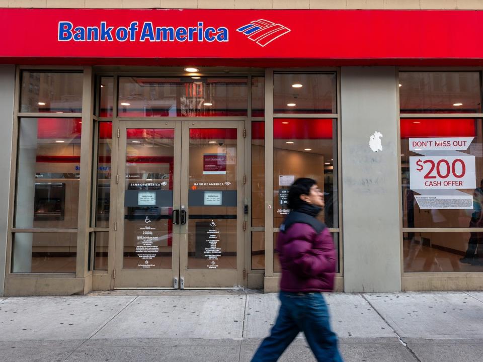 Person walks by a Bank of America location