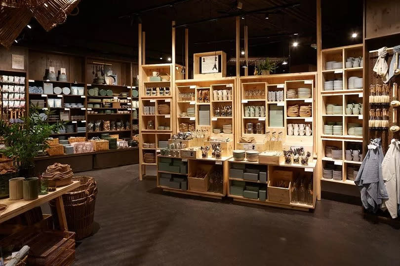 Søstrene Grene is opening one of its Scandi-inspired stores in Tunbridge Wells - its first store in Kent - lots of kitchen ware set out on pine shelves - low lighting, a nice ambience