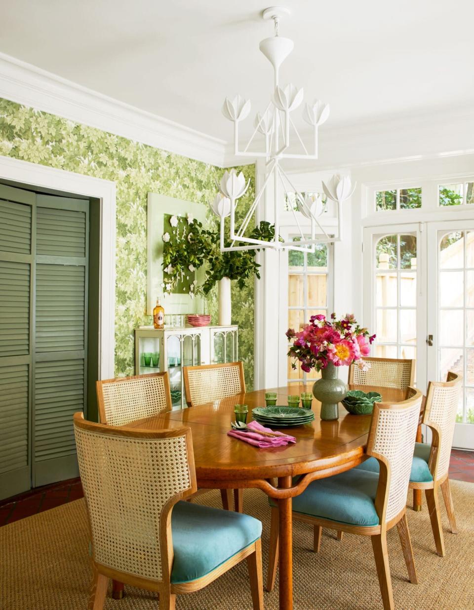 Dining Room with Green Wallpaper and White Chandelier