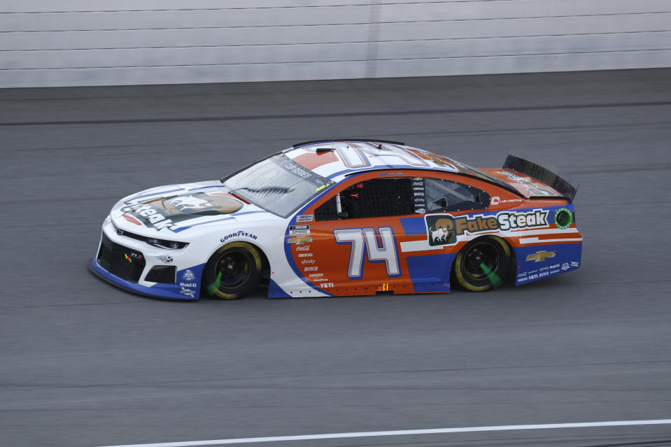 FILE - Reed Sorenson races in a casr showing Fake Steak signage during a NASCAR Cup Series auto race at Michigan International Speedway in Brooklyn, Mich., in this Saturday, Aug. 8, 2020, file photo. Kevin James stars as crew chief Kevin Gibson in Netflix’s new comedy series, “The Crew,” the latest in a line of NASCAR-themed TV shows and movies where the source material traditionally bordered on good ol’ boys satire or sensationalism rather than grounded in reality. The team fields the No. 74 Fake Steak-sponsored car. (AP Photo/Paul Sancya, File)