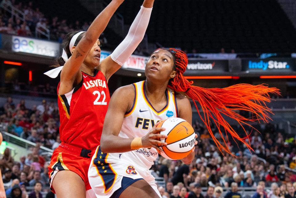 Jun 4, 2023; Indianapolis, Indiana, USA; Indiana Fever center Aliyah Boston (7) shoots the ball while Las Vegas Aces forward A'ja Wilson (22) defends in the first half at Gainbridge Fieldhouse.