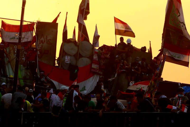 Iraqi demonstrators block Al Jumhuriya bridge during the ongoing anti-government protests in Baghdad