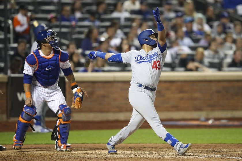 Los Angeles Dodgers' Edwin Rios watches his two-run home run during the eighth inning of the team's baseball game against the New York Mets, Friday, Sept. 13, 2019, in New York. (AP Photo/Mary Altaffer)