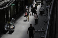 People walk through the old main bazaar of Tehran, Iran, Thursday, June 13, 2024. The rise of the “Hamster Kombat” app in Iran highlights a harsher truth facing the Islamic Republic's economy ahead of its presidential election this week to replace the late President Ebrahim Raisi, who died in a helicopter crash in May. (AP Photo/Vahid Salemi)