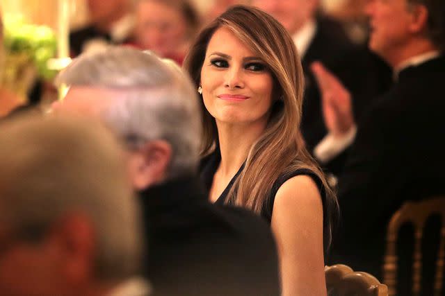 <p>Chip Somodevilla/Getty Images</p> Melania Trump hosts a black tie dinner at the White House in 2017