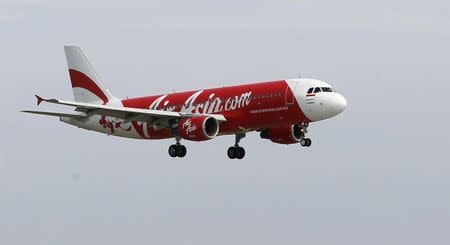 An Indonesia AirAsia Airbus A320-200 passenger prepares to land at Sukarno-Hatta airport in Tangerang on the outskirts of Jakarta in this January 30, 2013 file picture. REUTERS/Enny Nuraheni/Files