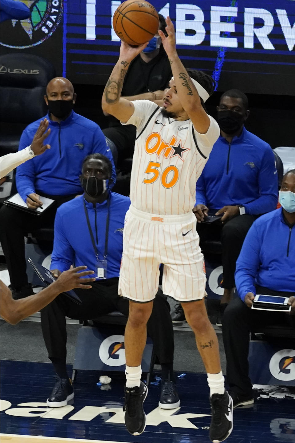 Orlando Magic's Cole Anthony shoots the game-winning 3-point basket at the buzzer against the Minnesota Timberwolves in an NBA basketball game, Wednesday, Jan. 20, 2021, in Minneapolis. The Magic won 97-96. (AP Photo/Jim Mone)