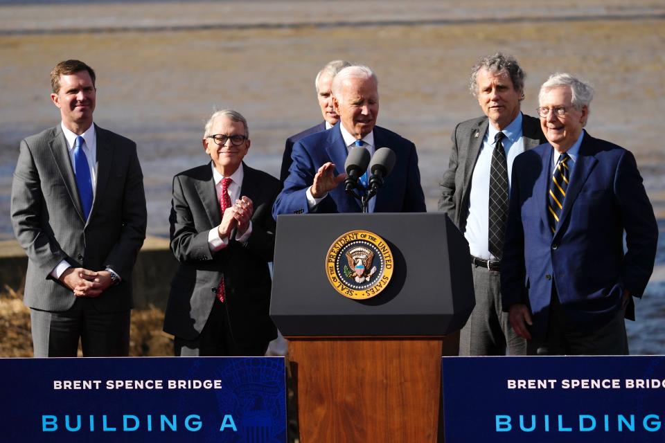 From left: Kentucky Gov. Andy Beshear, Ohio Gov. Mike DeWine, former Ohio Sen. Rob Portman, Ohio Sen. Sherrod Brown and Kentucky Sen. Mitch McConnell listen as President Joe Biden touts a $1.6 billion federal investment in the long-awaited upgrade of the Brent Spence Bridge, Wednesday, Jan. 4, 2023, in Covington, Ky.