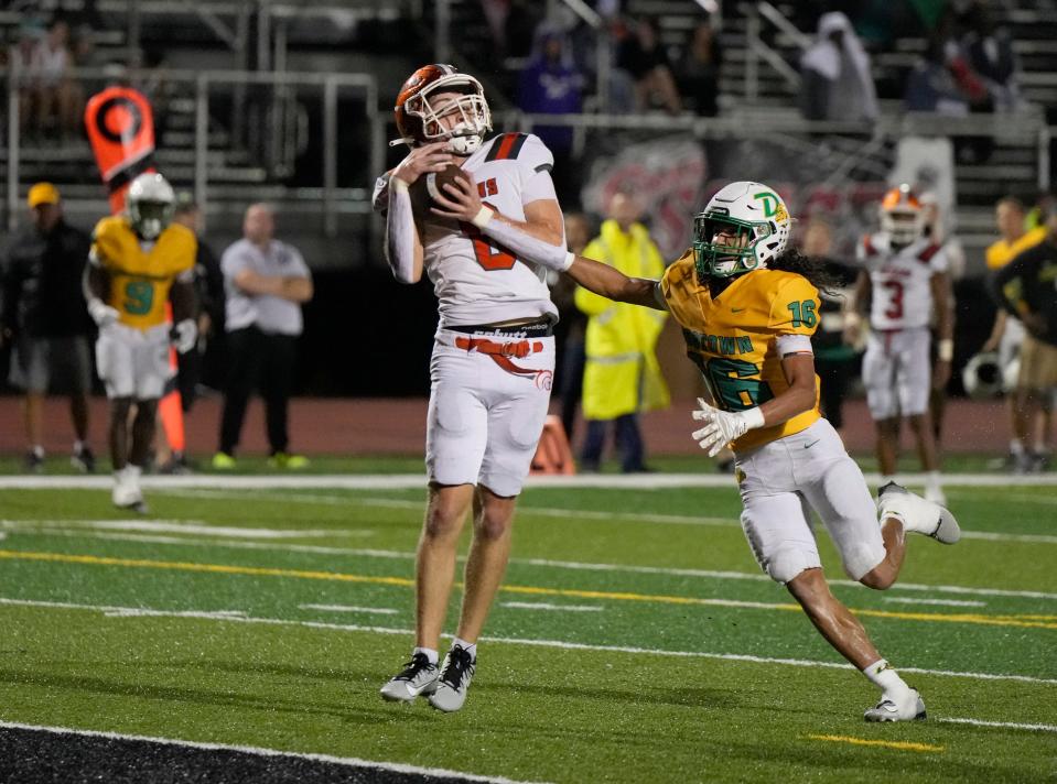 University's Isaiah Baker (6) pulls down a pass for touchdown during a playoff game with DeLand at New Smyrna Beach Sports Complex, Friday, Nov. 17, 2023.