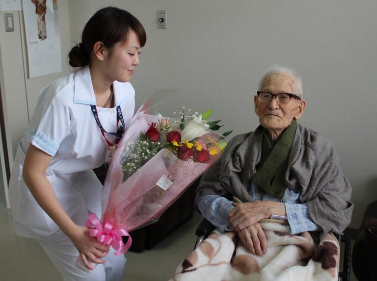 Jiroemon Kimura receives a flower bouquet on his birthday in 2012 at a hospital in Kyotango, Kyoto. Kimura turned 116 on Friday as local health chiefs in Japan launch a study to find out why he and many of those around him have lived so long