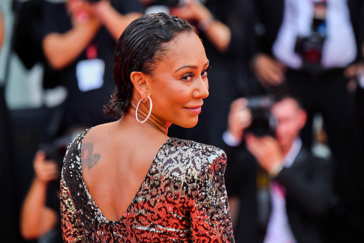 Melanie Brown walks the red carpet ahead of the opening ceremony during the 76th Venice Film Festival at Sala Casino on August 28, 2019 in Venice, Italy. (Photo by Stephane Cardinale - Corbis/Corbis via Getty Images)