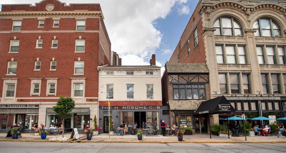 Father's Day outdoor dining blends together in front of The Handsome Cab, Tutoni's and Rockfish Public House in the second block of North George Street in York.