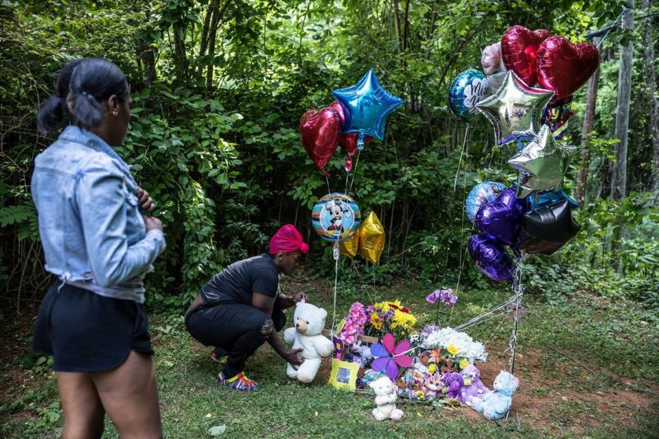People leave gifts at a memorial for the body of a 4 year old girl that was found at the 3700 block of Braden Drive in Charlotte, N.C., on Monday, May 24, 2021.