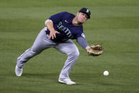 Seattle Mariners second baseman Ty France reaches for but can't catch a fly ball from Los Angeles Dodgers' Will Smith during the fourth inning of a baseball game Wednesday, May 12, 2021, in Los Angeles. Smith singled on the play. (AP Photo/Marcio Jose Sanchez)