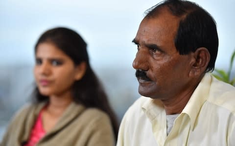 Ashiq Mesih and Eisham Ashiq, the husband and daughter of Asia Bibi, speak during an interview with AFP in London on October 12, 2018 - Credit: BEN STANSALL/AFP